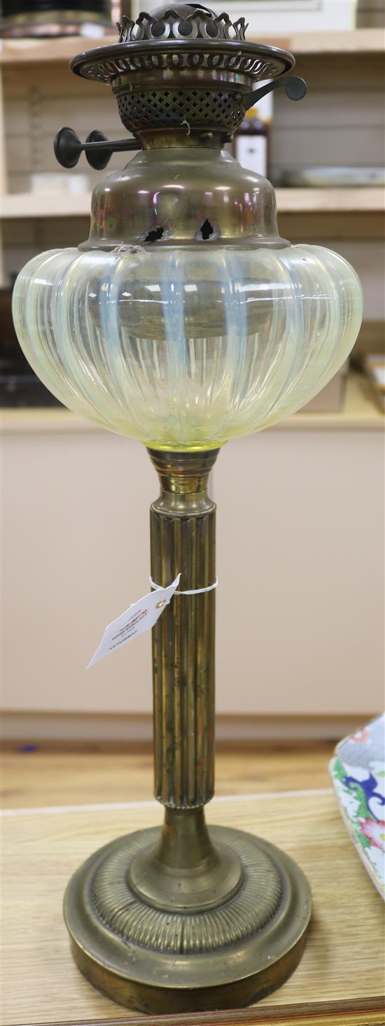 A Victorian brass oil lamp with vaseline glass reservoir